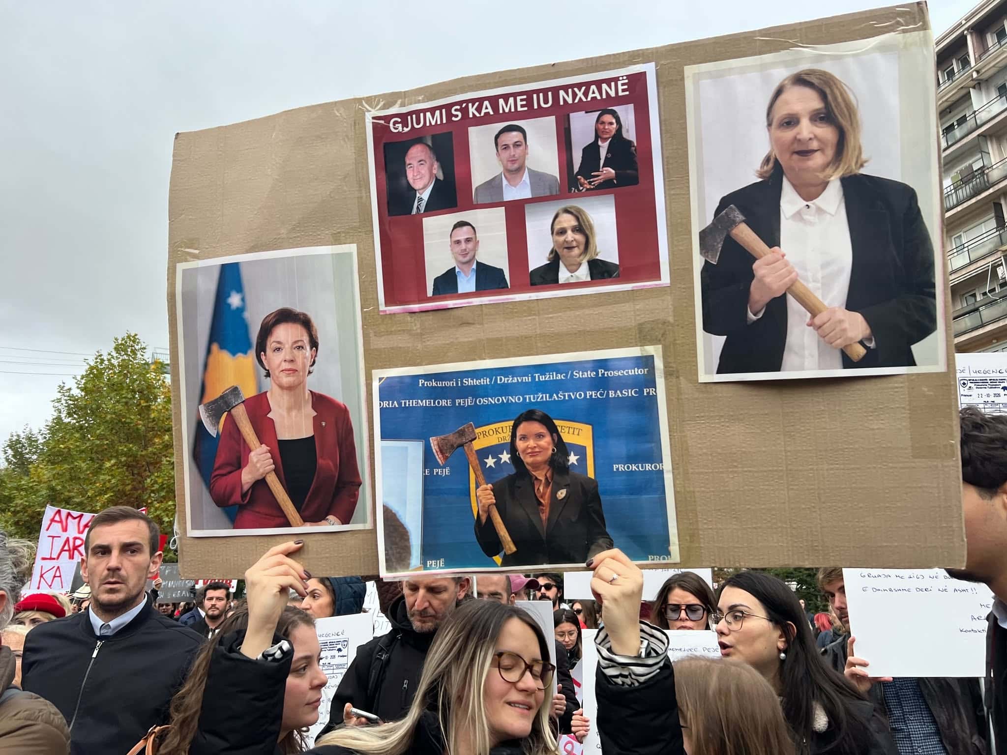 Dhujumi ska i toxemën, placards with photos of Gervala and Vucetaj in protest of the murder of Arlinda Zekaj